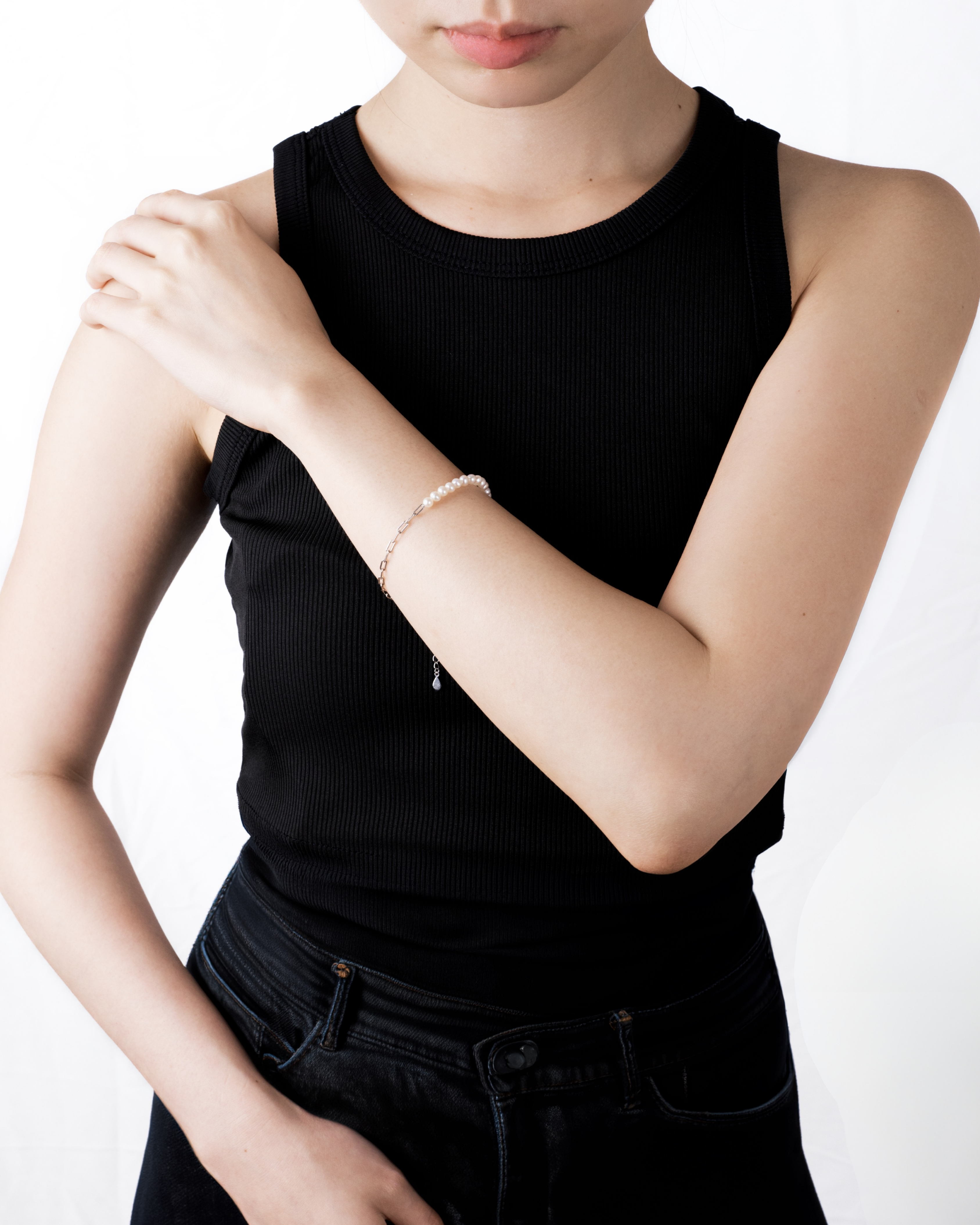 Sora bracelet stacked with other minimalist bracelets