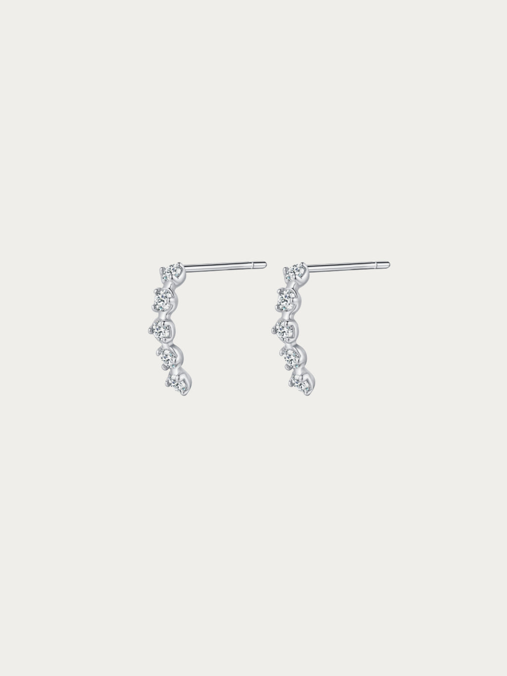 Starfall Stud Earrings with four graduated round CZ stones cascading diagonally in rhodium-plated 925 silver, front view