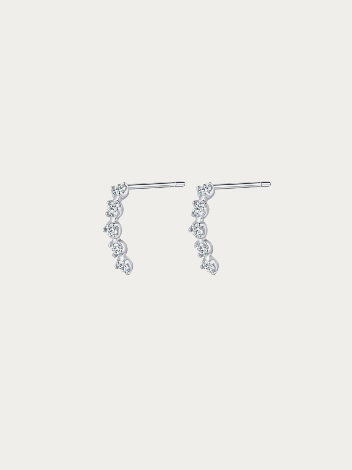 Starfall Stud Earrings with four graduated round CZ stones cascading diagonally in rhodium-plated 925 silver, front view