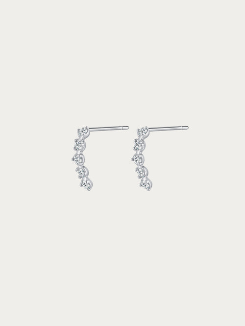 Starfall Stud Earrings with four graduated round CZ stones cascading diagonally in rhodium-plated 925 silver, front view