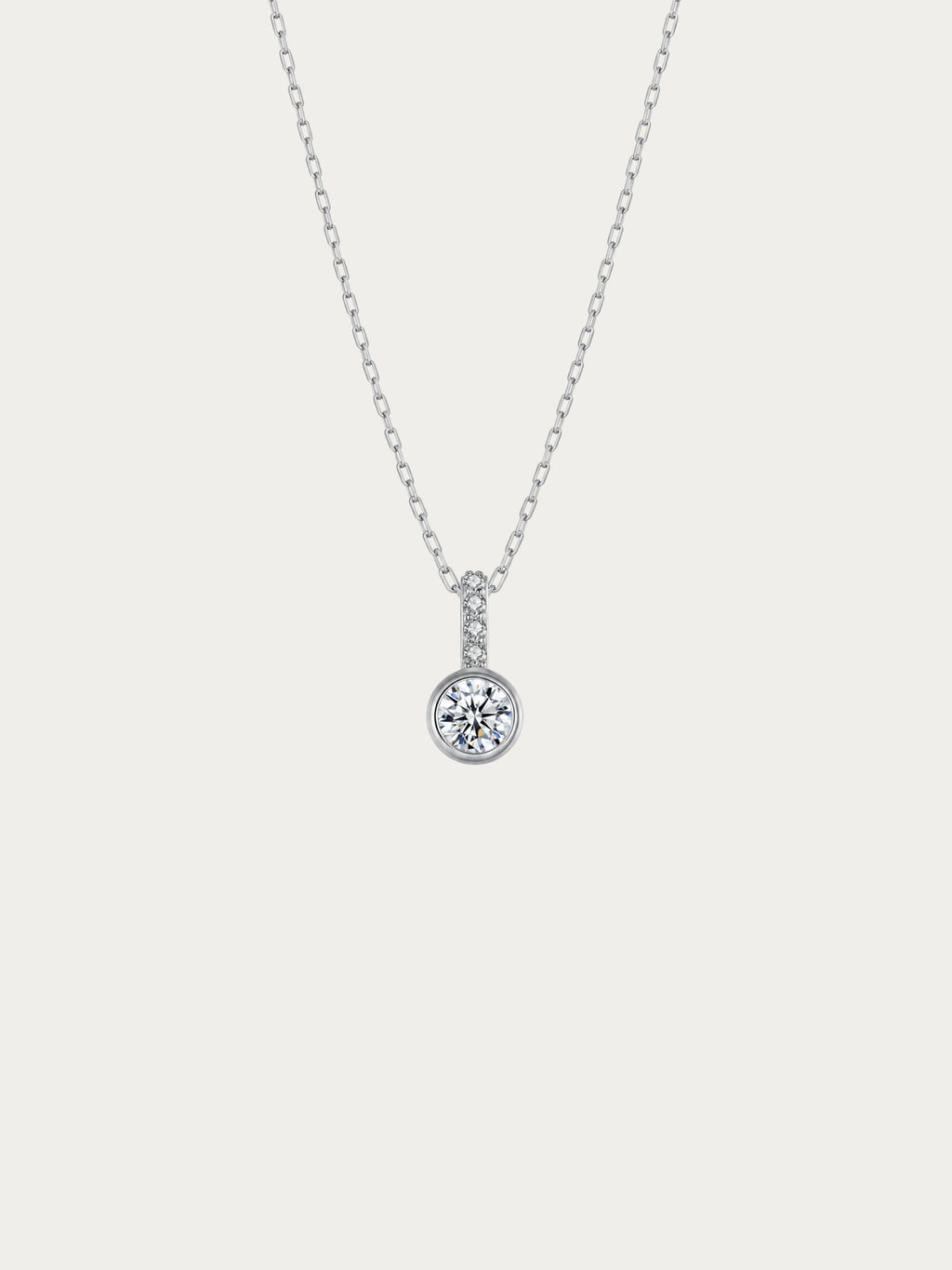 Sunrise solitaire necklace with a bezel-set round CZ under a pavé bail in rhodium-plated 925 sterling silver, front view
