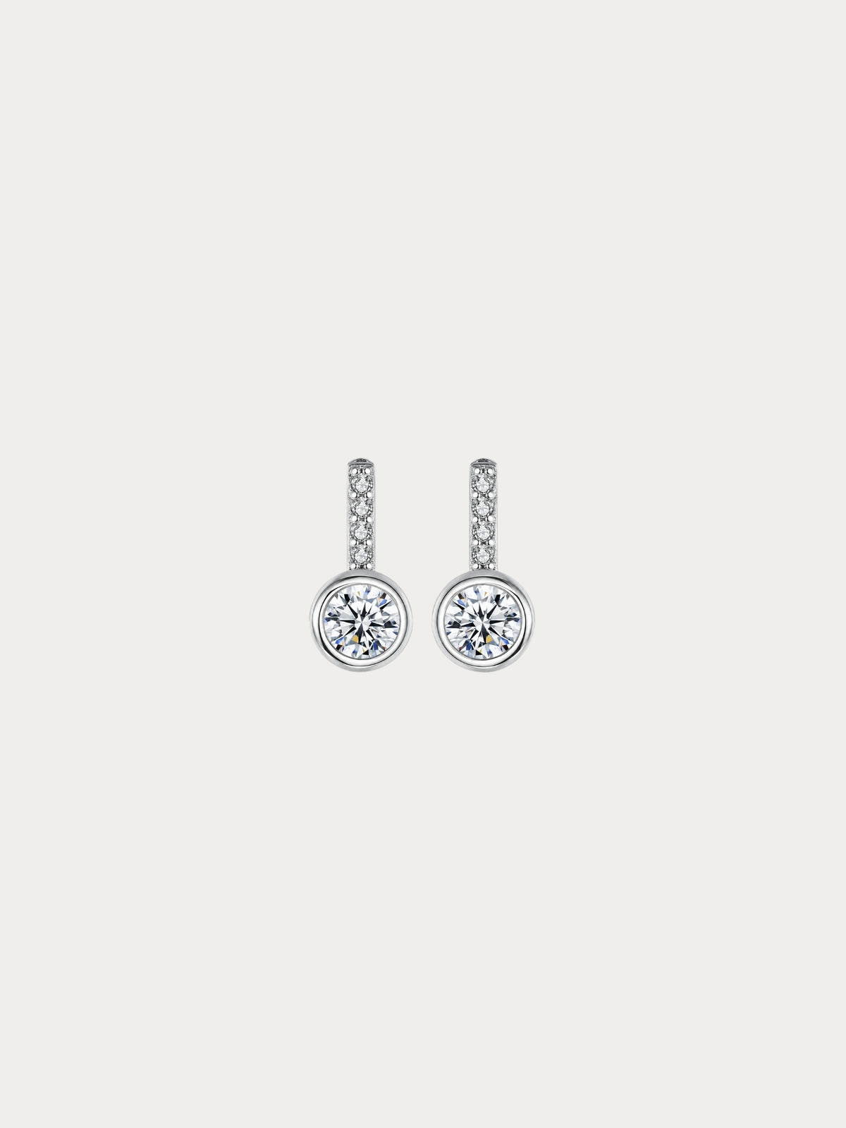 Sunrise solitaire stud earrings with a bezel-set round CZ beneath a pavé bar in rhodium-plated 925 silver, front view