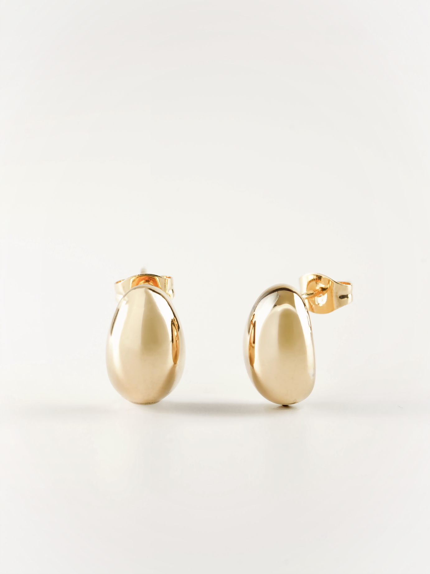 Front-facing view of Tauri soft bean dome stud earring