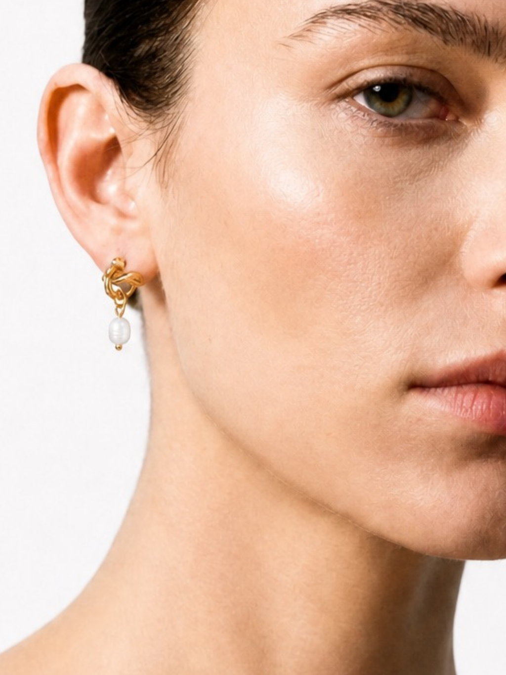 Model wearing MNML Twist Knot Freshwater Pearl Earrings in gold— everyday pearl earrings Malaysia