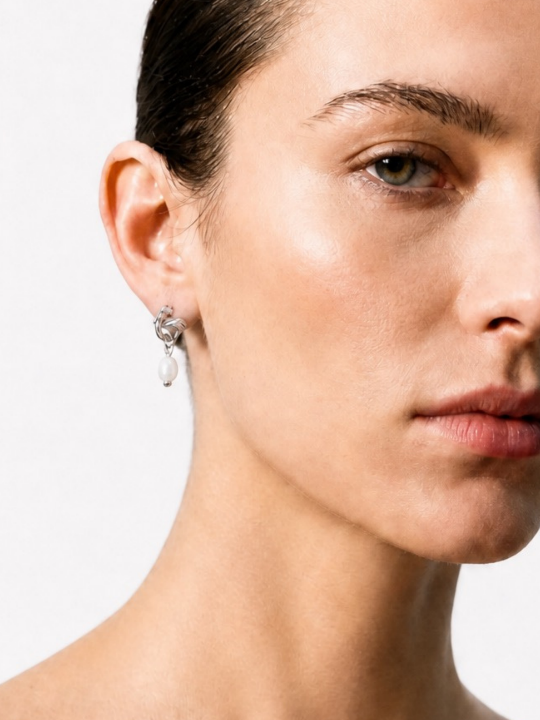 Model wearing MNML Twist Knot Freshwater Pearl Earrings in silver— everyday pearl earrings Malaysia