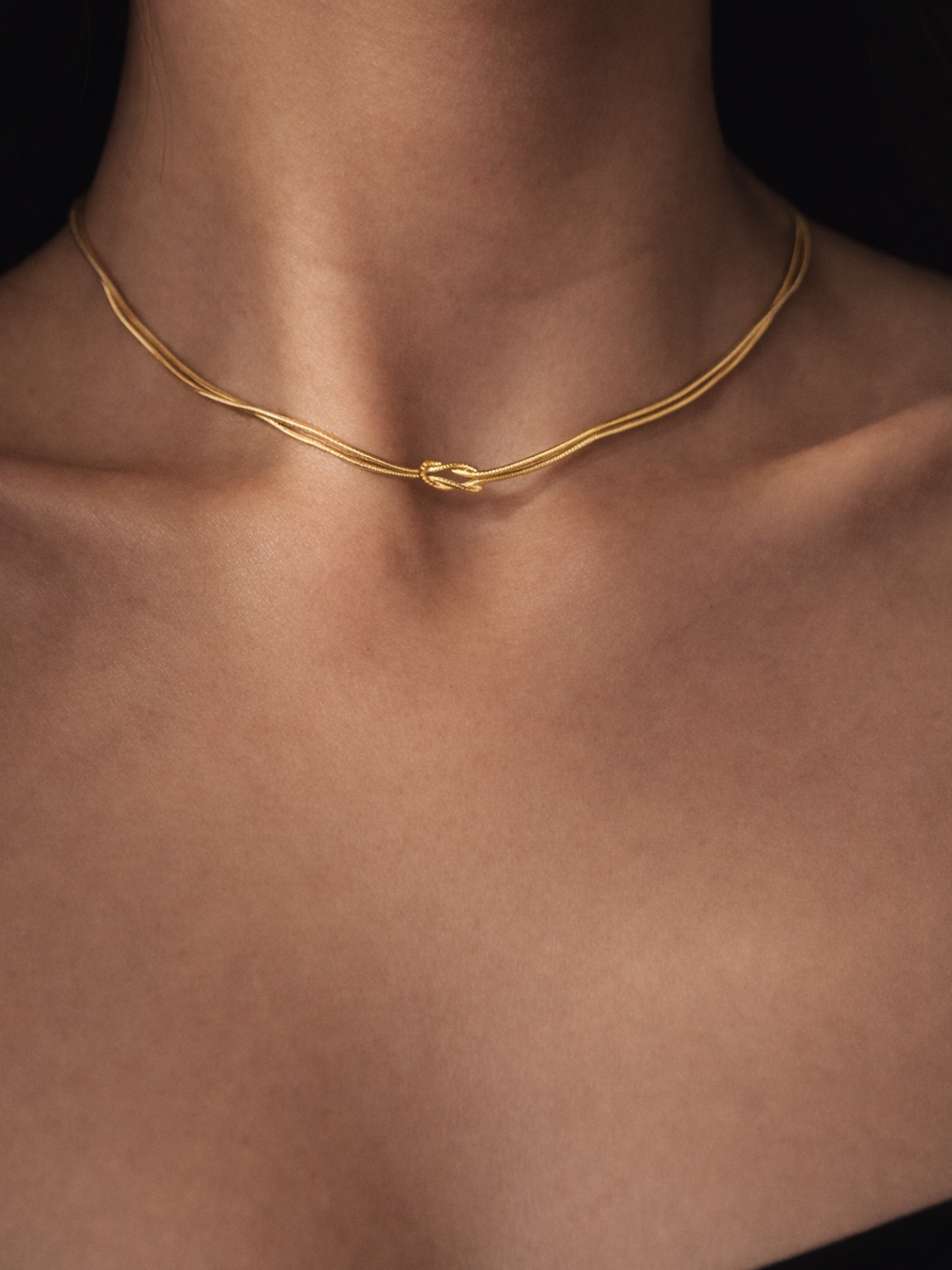 Model wearing MNML Unity Knotted Snake Chain Necklace at collarbone — everyday knot necklace Malaysia