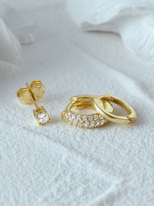 5A CZ brilliance detail on MNML Valentina 18K Gold Pavé Single Huggie — warm gold stone setting