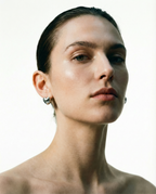 Venus earrings styled with other stacked earrings