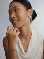 Model wearing MNML x Zee Avi Trio Hibiscus Bracelet on wrist