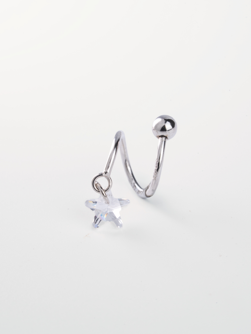 Star CZ pendant close-up on MNML Ziggy Star Spiral Barbell Earring — 5.22mm star cut CZ drop