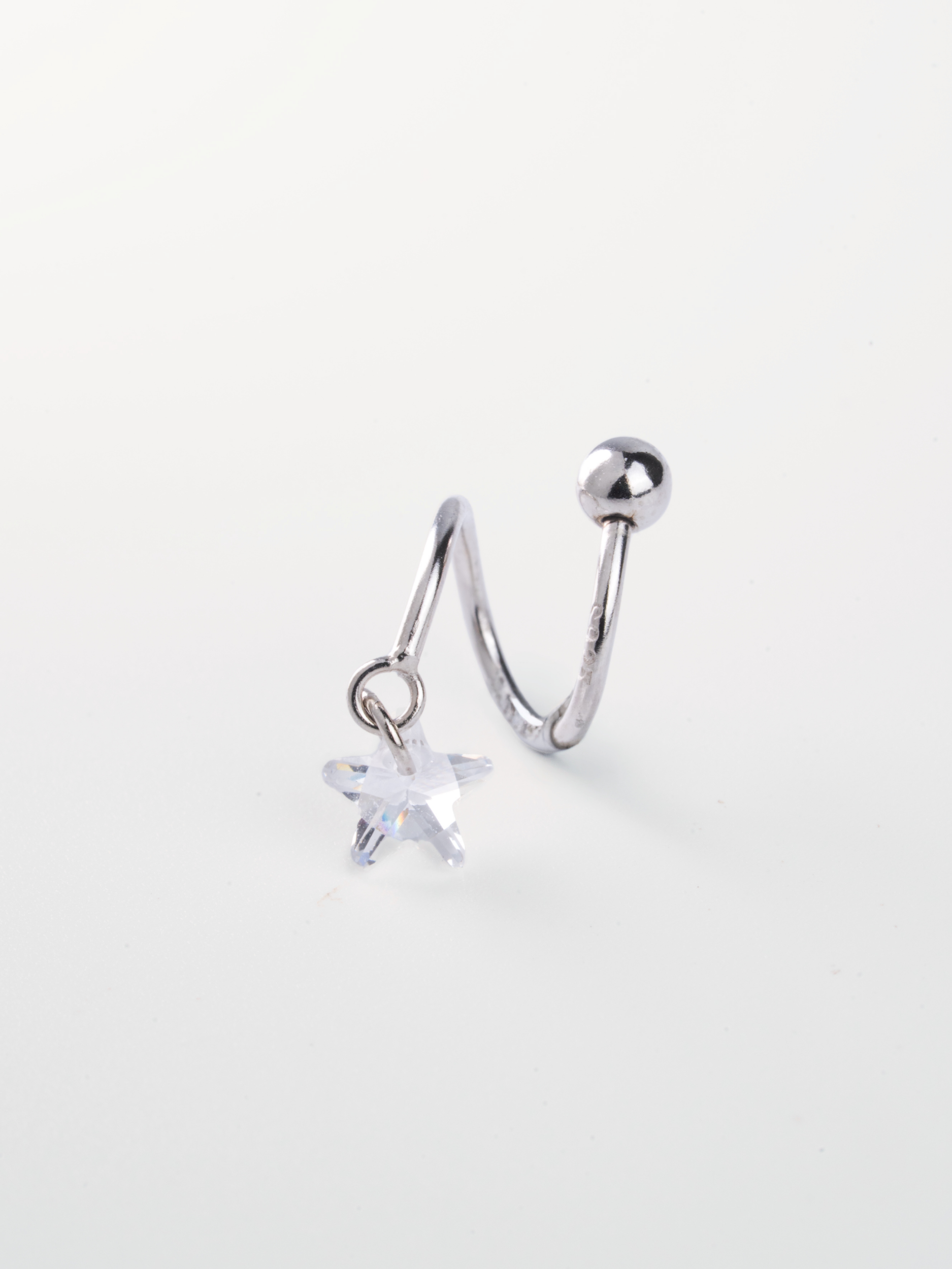Star CZ pendant close-up on MNML Ziggy Star Spiral Barbell Earring — 5.22mm star cut CZ drop