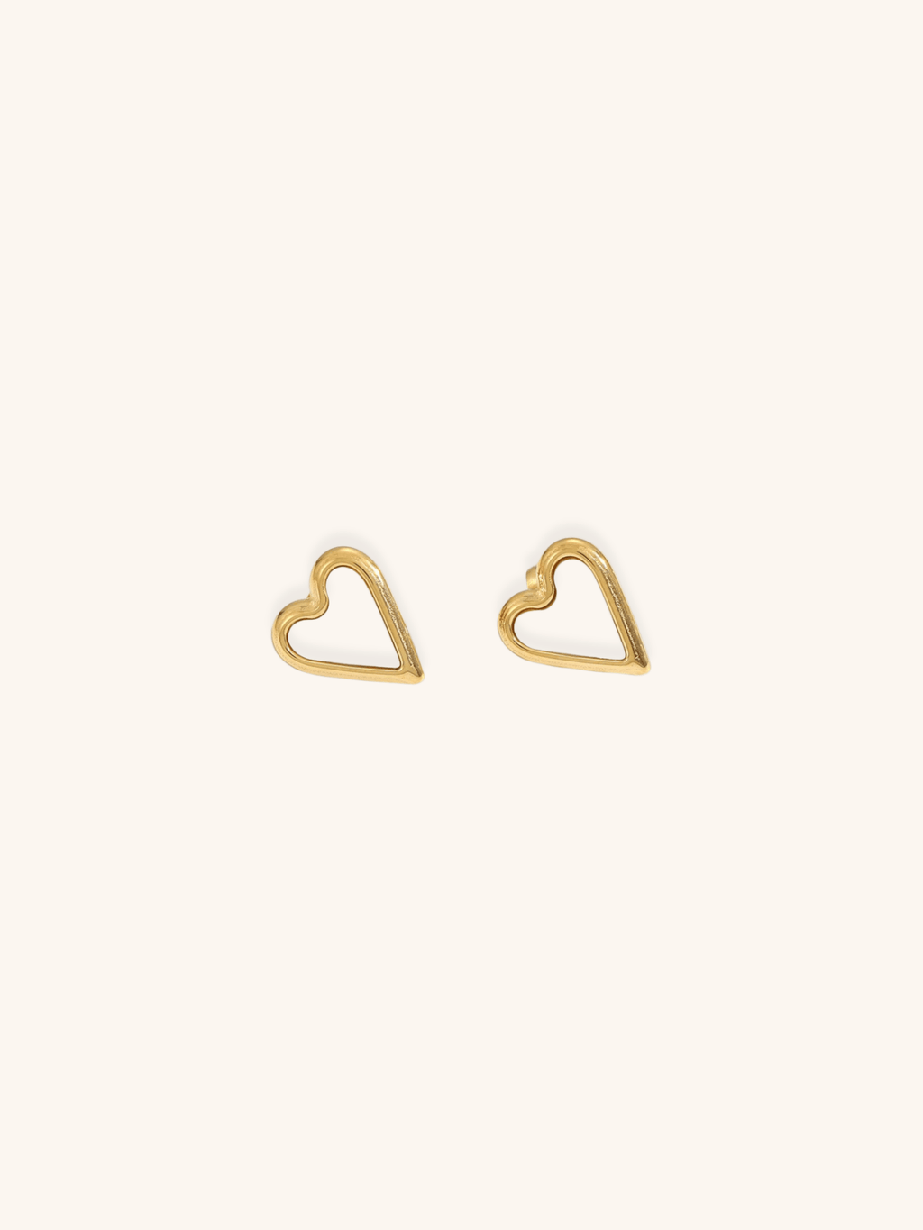 Mother of Pearl Heart Stud Earrings gold titanium, open heart frame with white MOP inlay, product flatlay