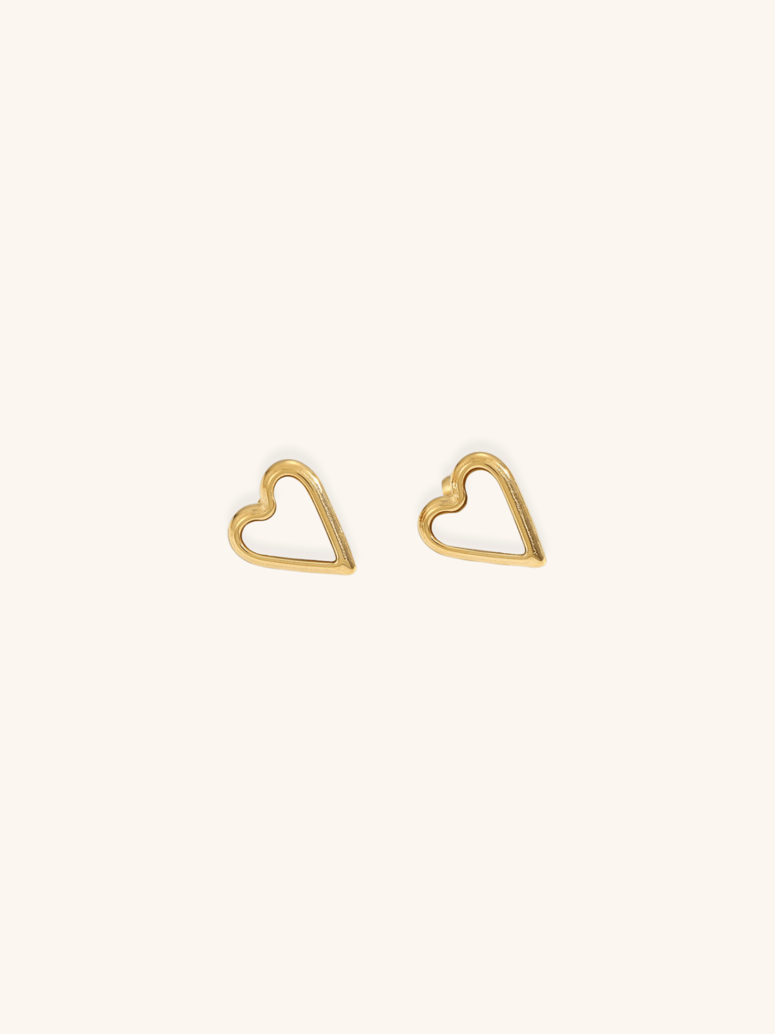 Mother of Pearl Heart Stud Earrings gold titanium, open heart frame with white MOP inlay, product flatlay