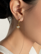Muse Diamond Core Earrings worn on model's ear