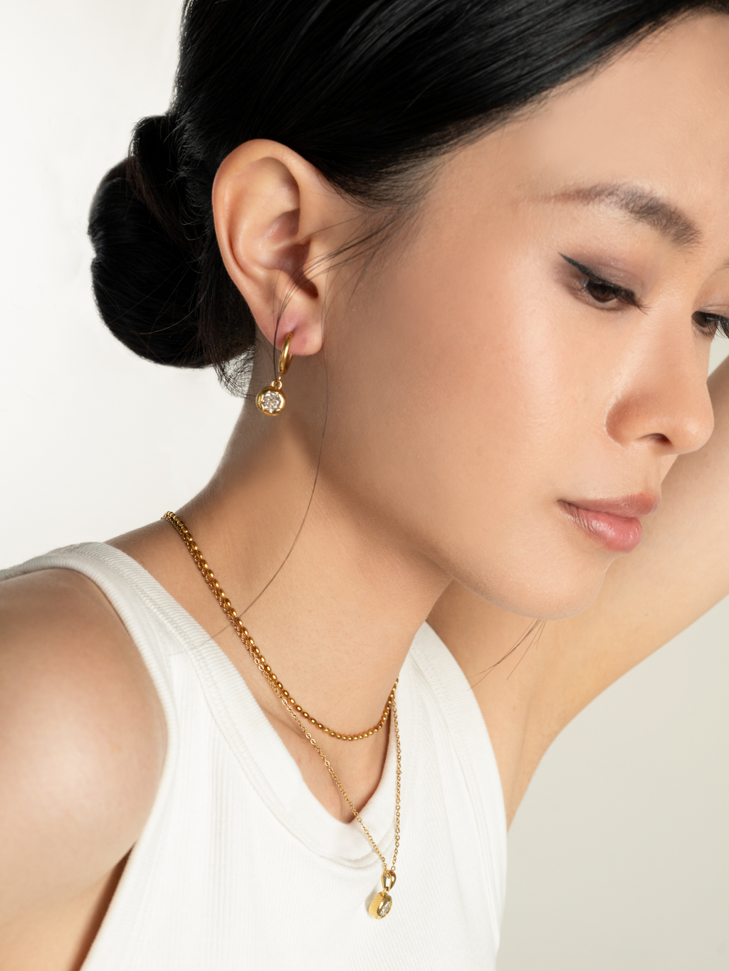 Angled view of Muse Diamond Core Earring showing huggie hoop and drop