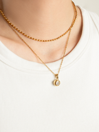 Close-up of bezel-set round brilliant cubic zirconia on Muse Necklace