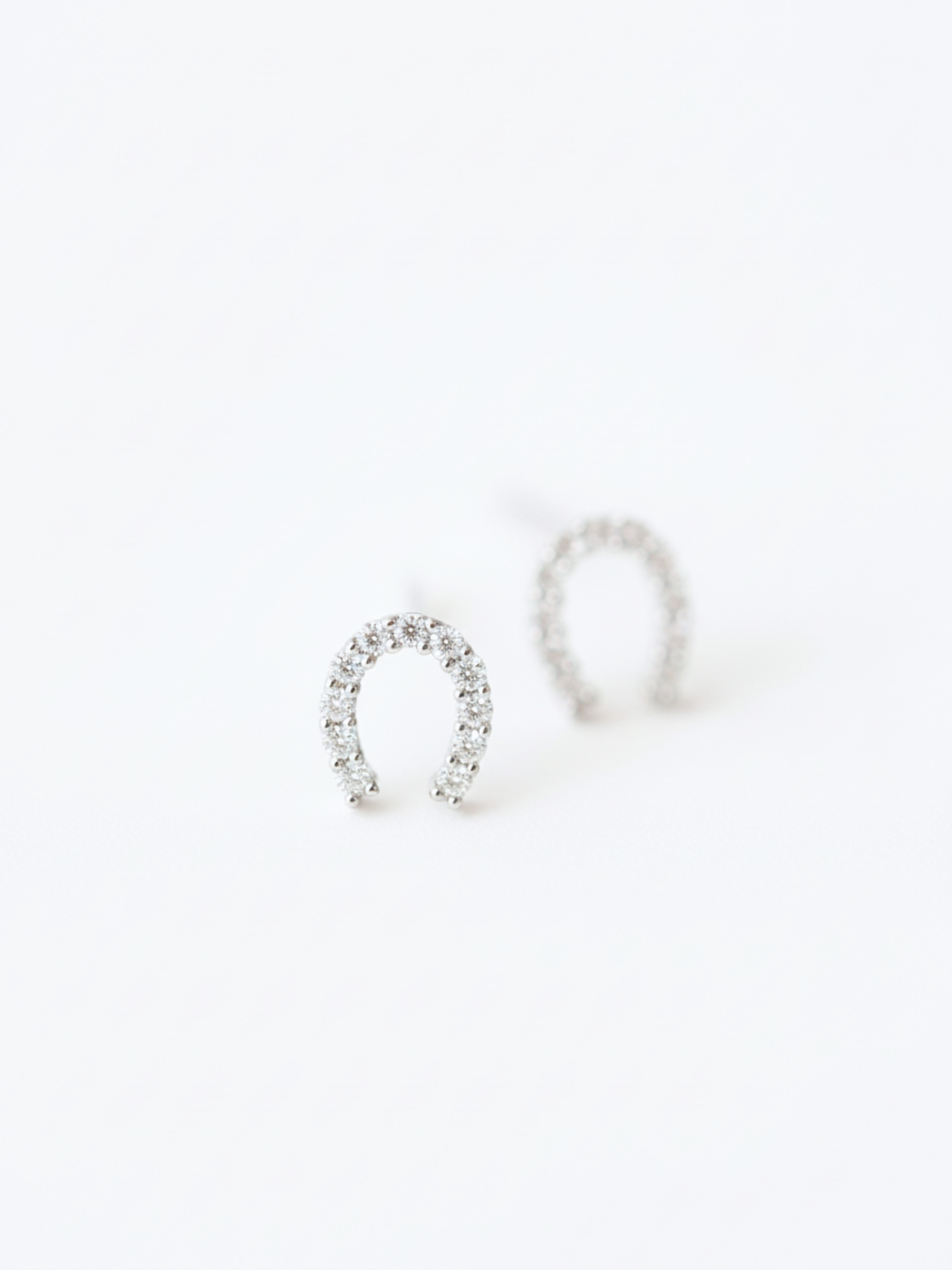 Macro detail of pavé cubic zirconia on Nia Horseshoe Studs