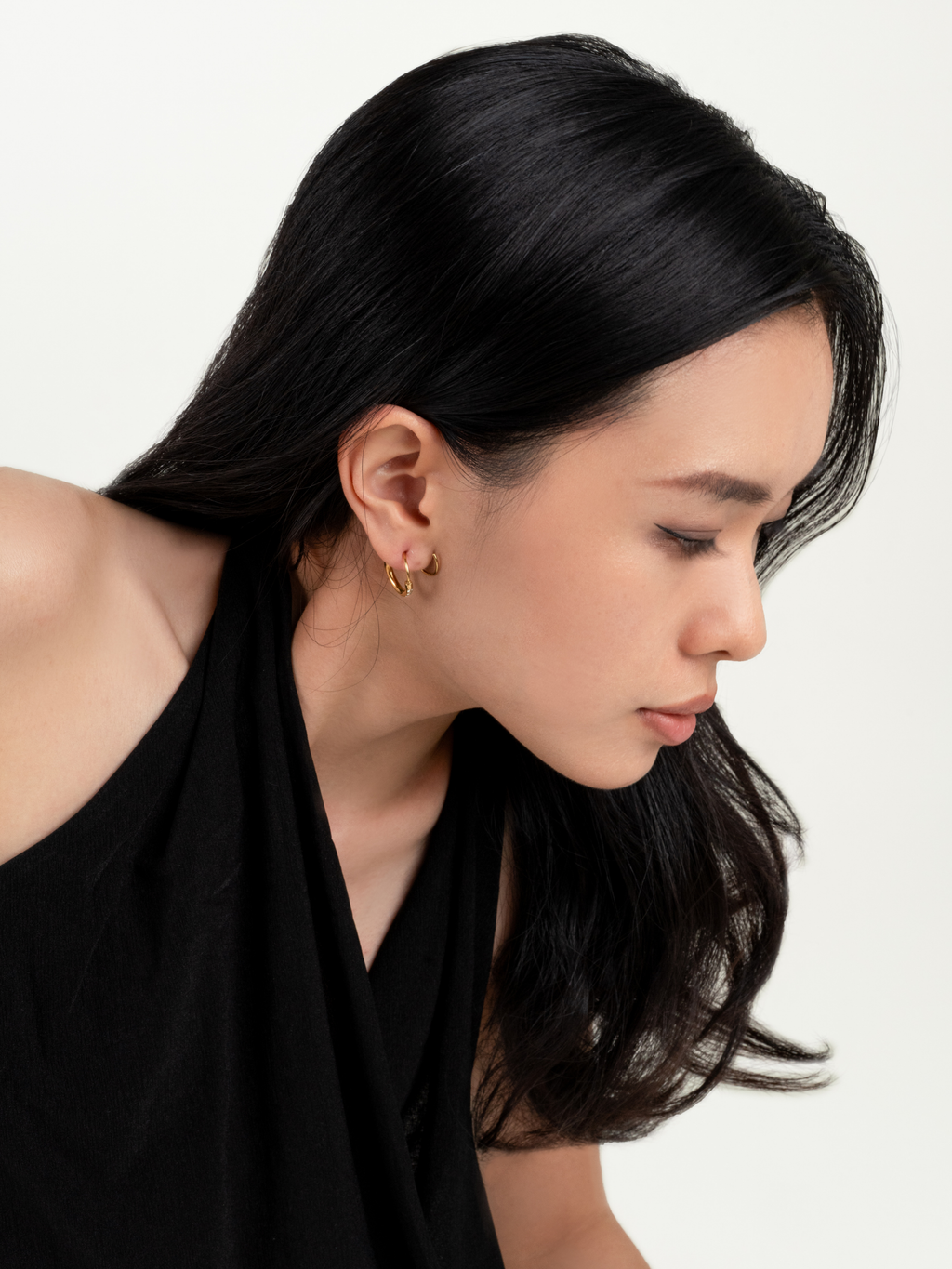 Nola Flow Hoop Earrings worn on model's ear