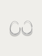 Nova Curve Earrings silver tone titanium, graduated open oval hoop tapering to fine wire tip, product flatlay