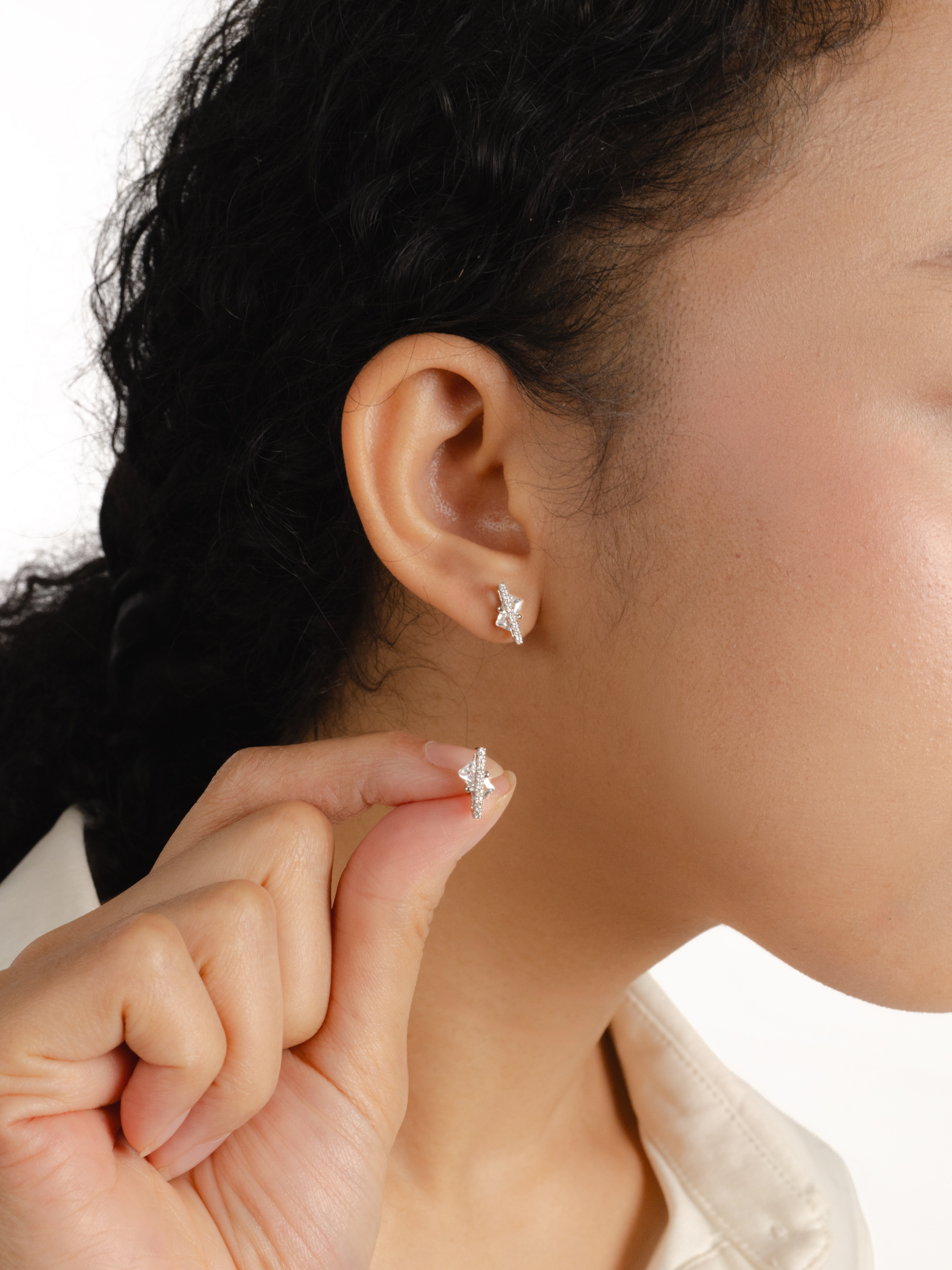 Nova Floating Prism Stud Earrings worn on ear