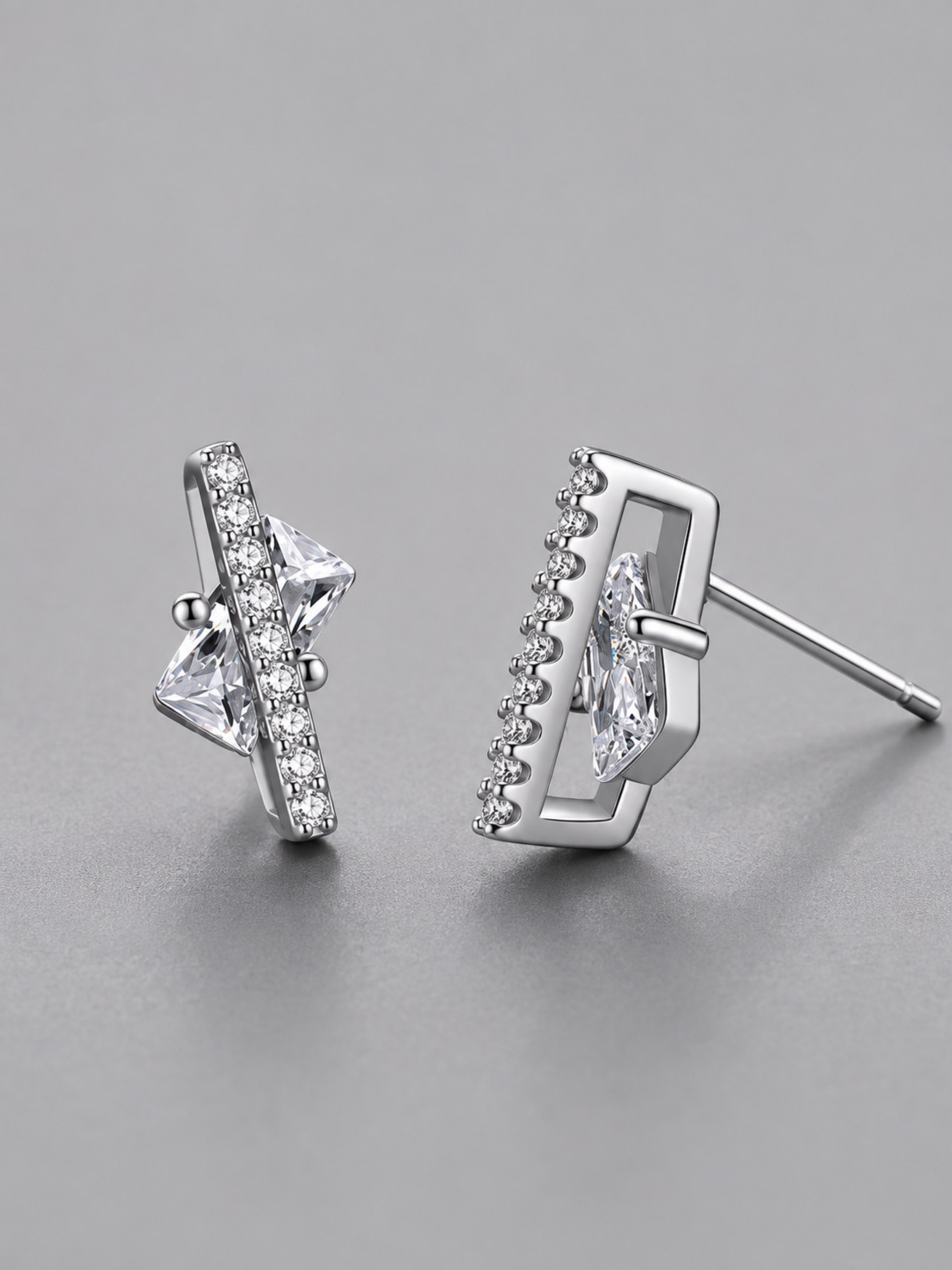 Macro detail of kite-cut cubic zirconia stones on Nova Floating Prism Stud Earrings