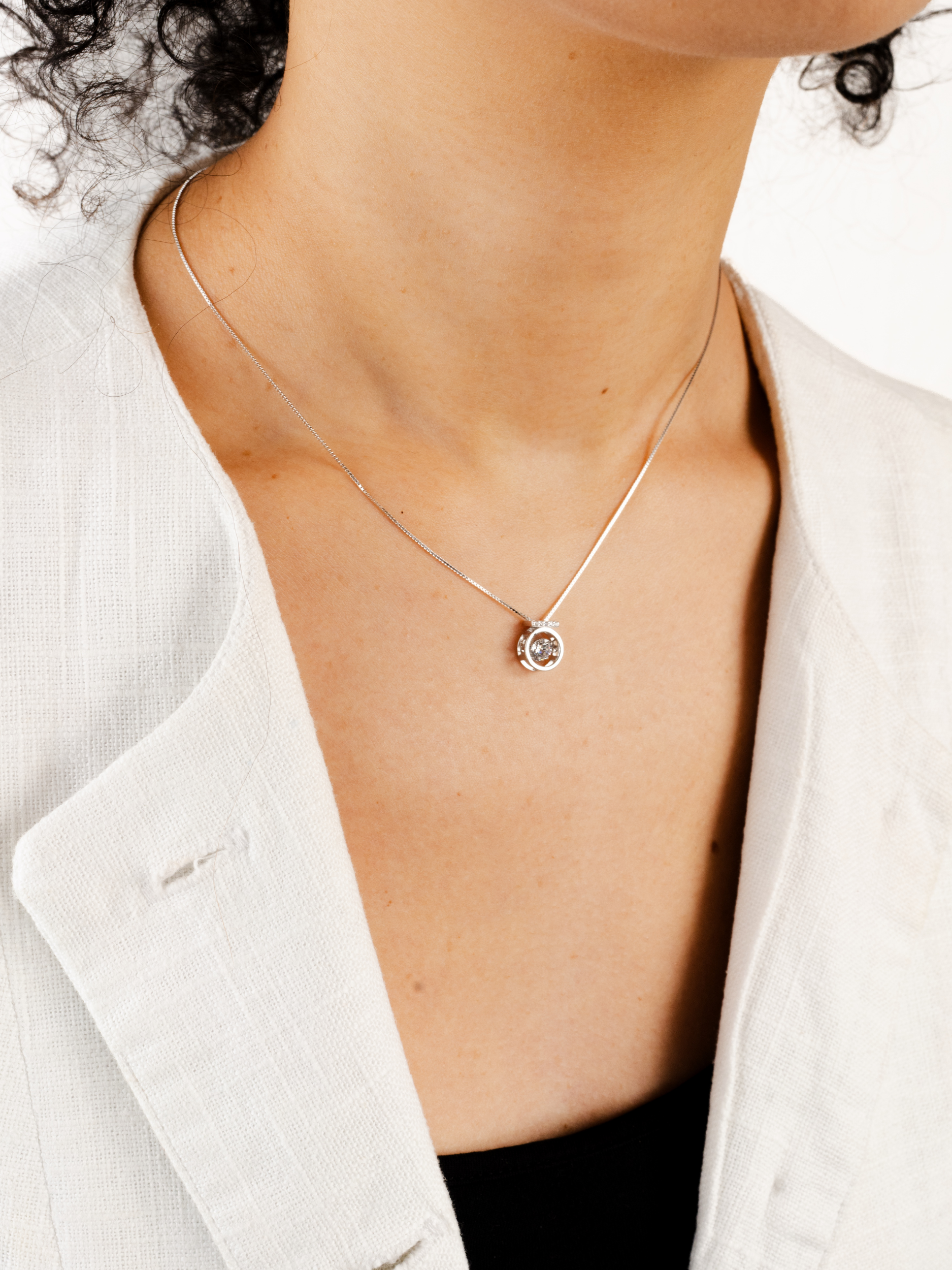 Close-up of pavé-set bail on Orianna Heartbeat Dancing Diamond Necklace