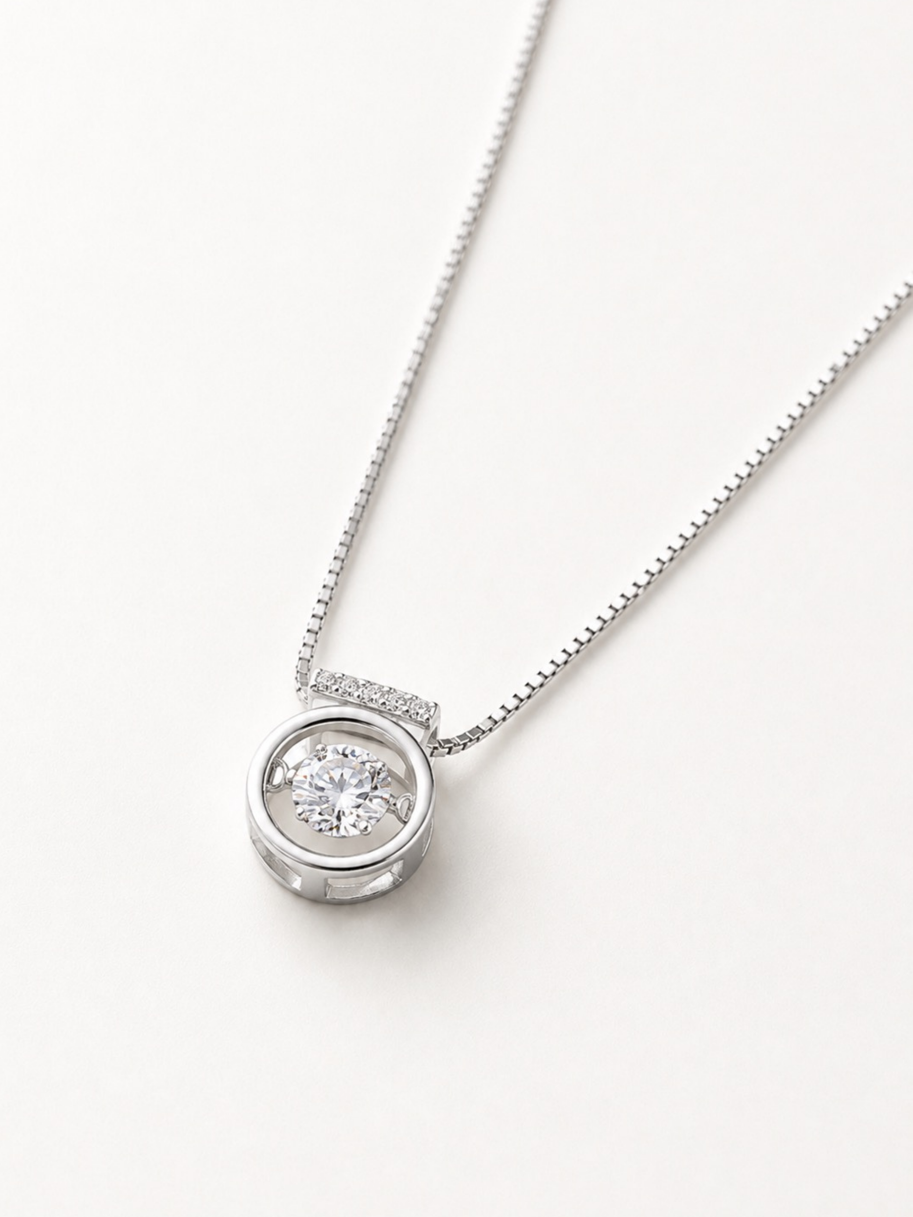 Macro detail of floating dancing stone on Orianna Heartbeat Dancing Diamond Necklace