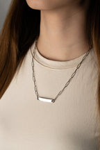 Close-up of wide rectangular engravable bar plate on Paperclip Chain Necklace, silver stainless steel