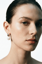 pearl drop earrings worn on ear minimalist style