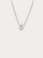 Petite Daisy Necklace in silver tone titanium, mini daisy pendant on fine chain, product flatlay