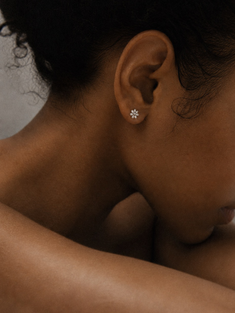 Petite Daisy Stud Earrings worn on model's ear