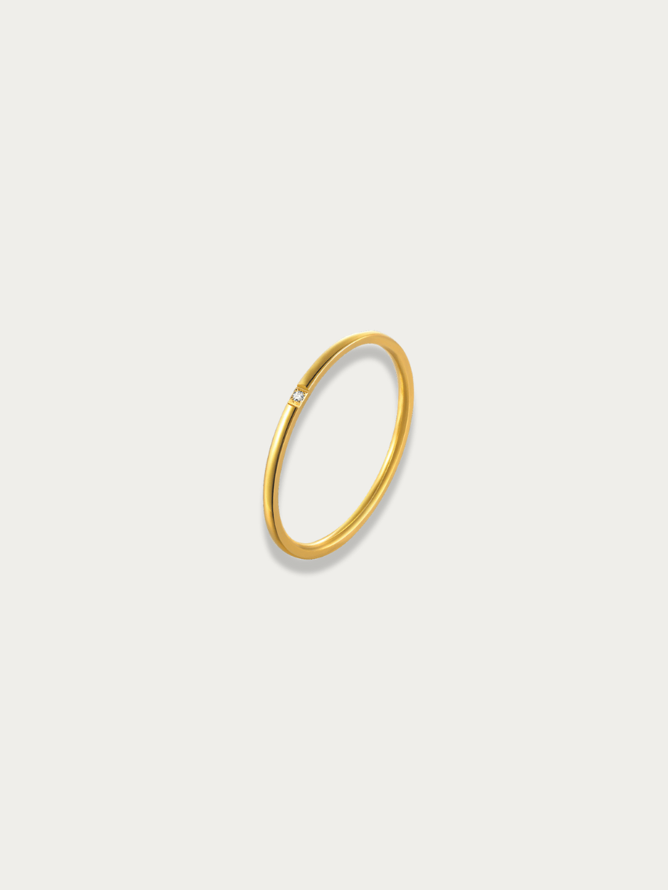 Petite Gem Stacking Ring gold tone stainless steel, ultra-slim band with flush-set square CZ, product flatlay