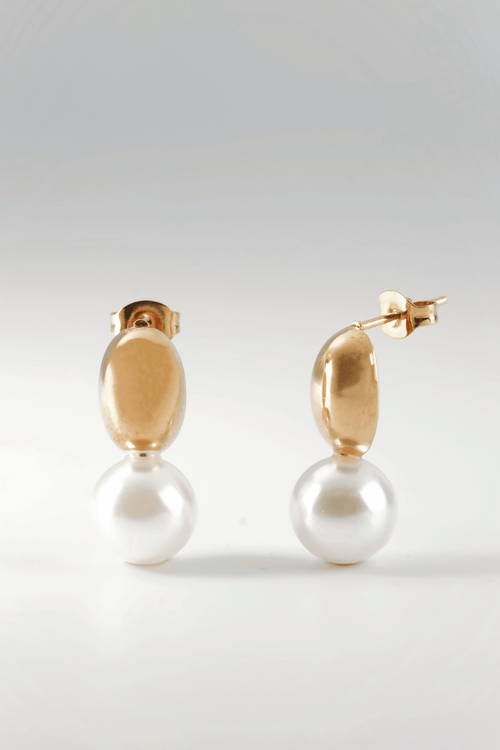 Poise Pearl Drop Earrings gold tone titanium, oval dome with suspended pearl drop, product flatlay