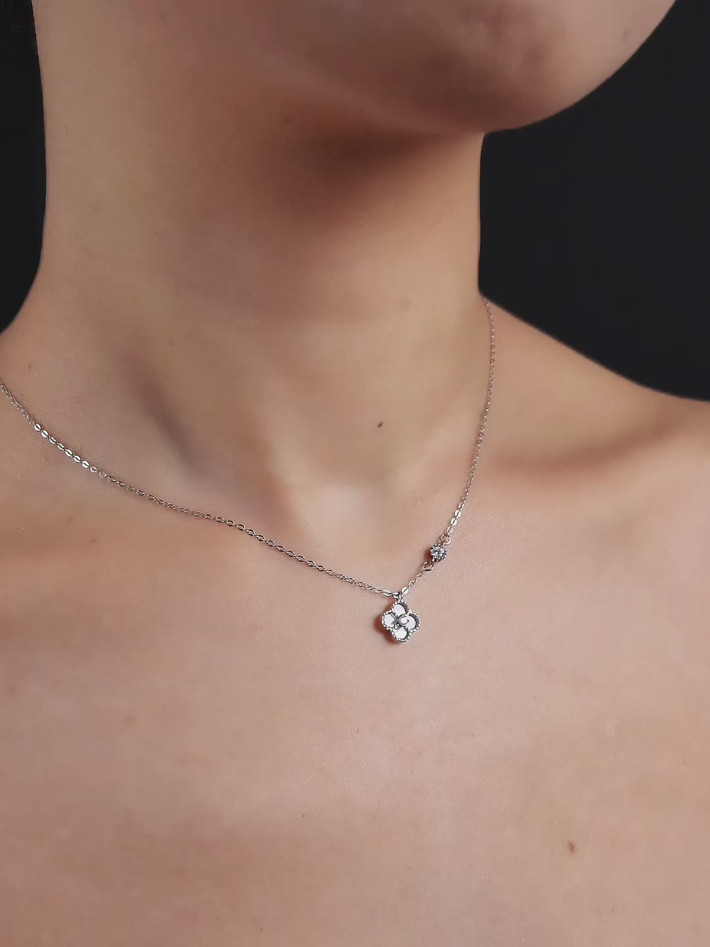 Close-up of Mother of Pearl clover pendant on Jolie necklace