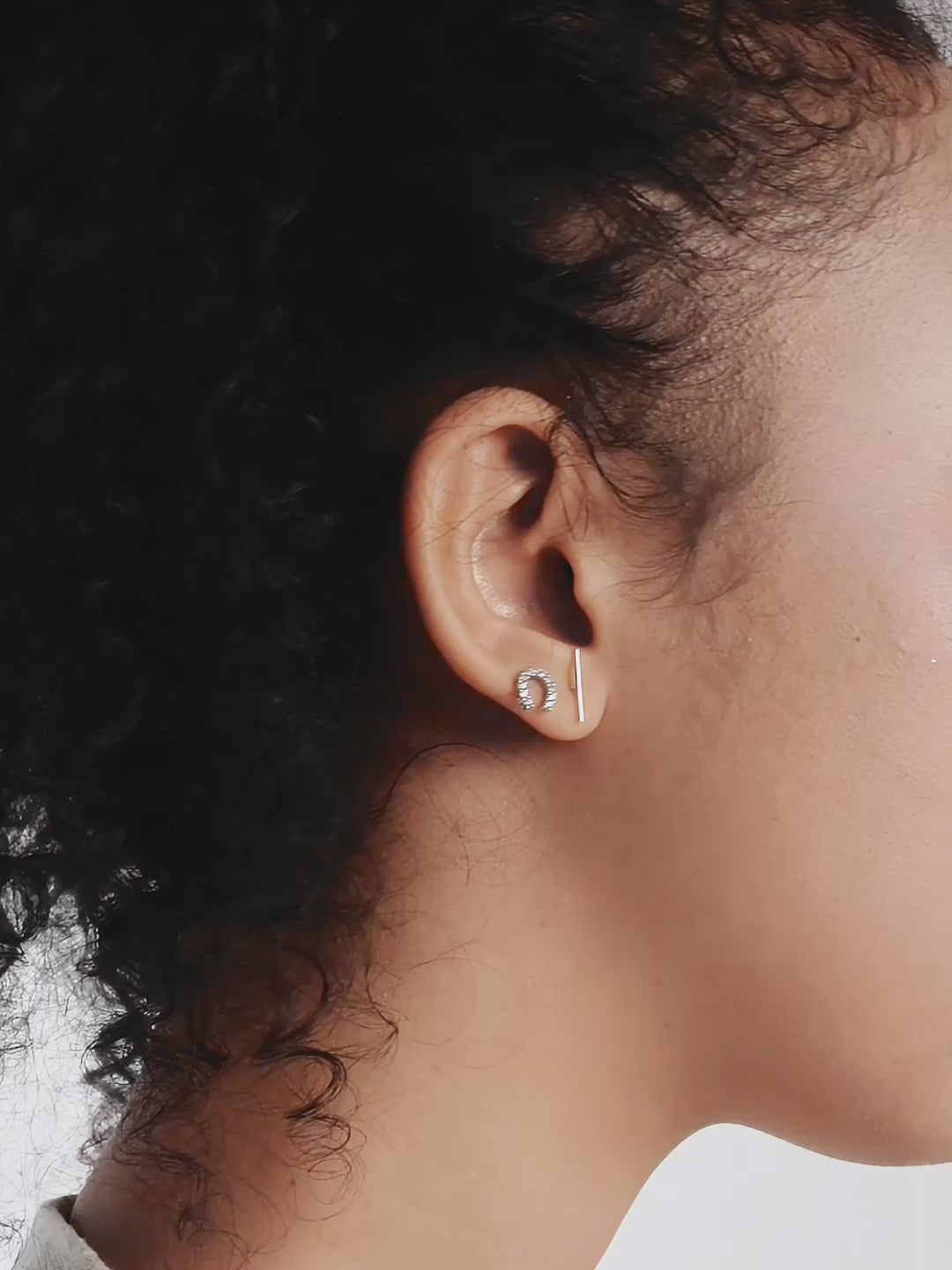 Nia Horseshoe Studs side profile showing horseshoe silhouette