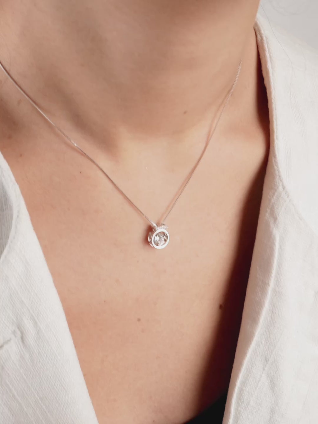 Close-up of pavé-set bail on Orianna Heartbeat Dancing Diamond Necklace