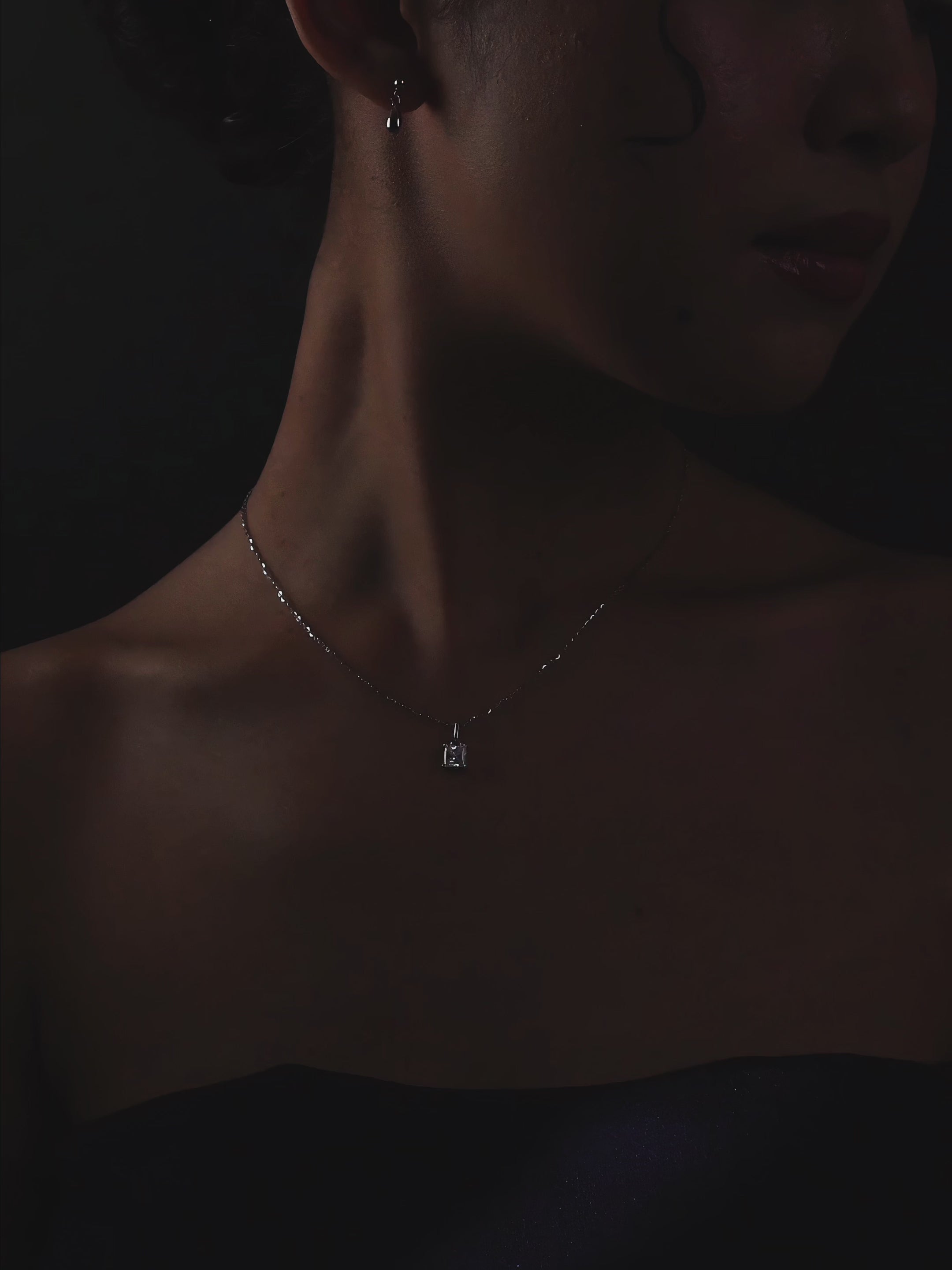 Close-up of princess-cut moissanite on Winifred necklace showing brilliance