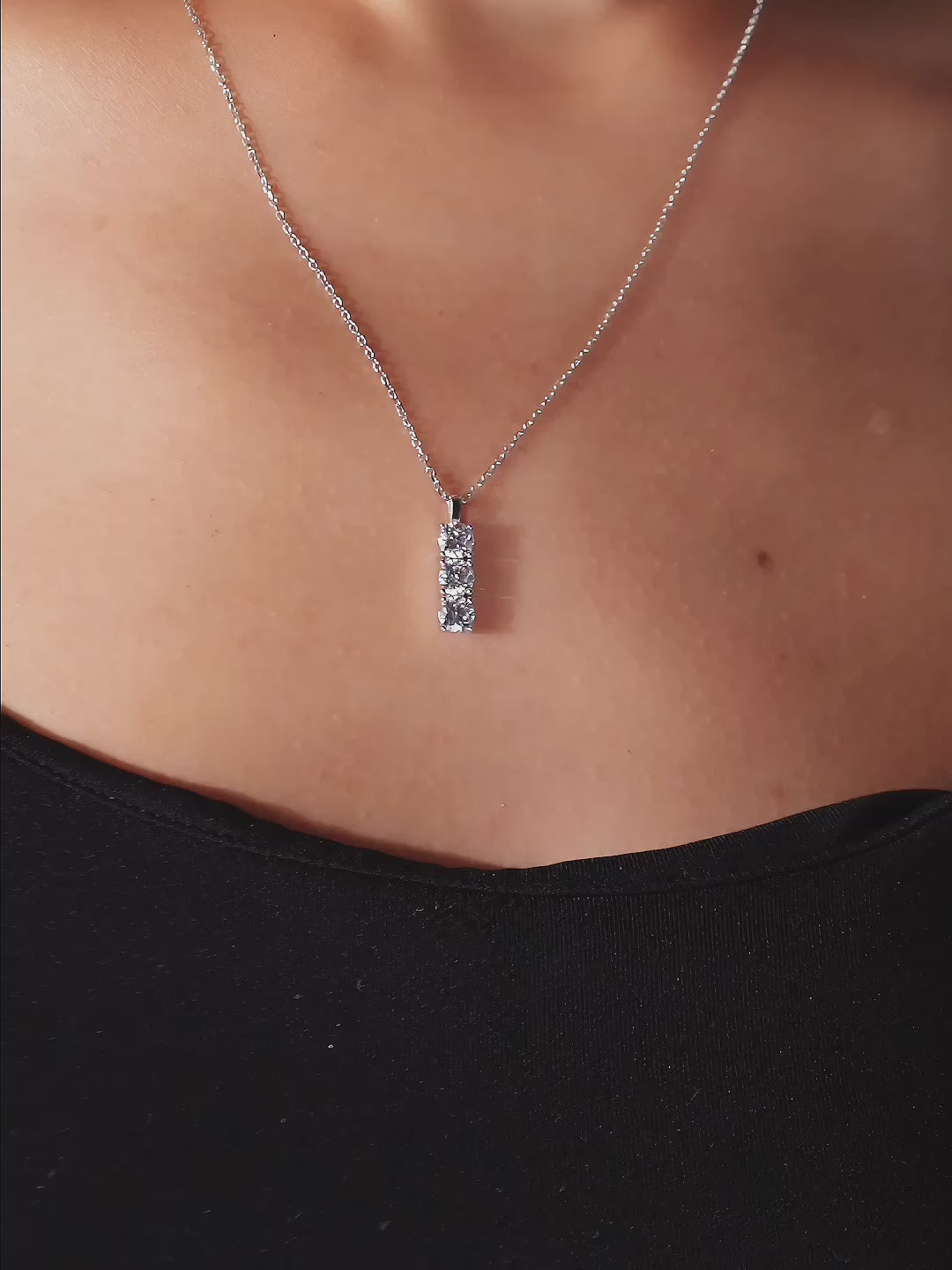 Angled view of Evermore necklace pendant and chain