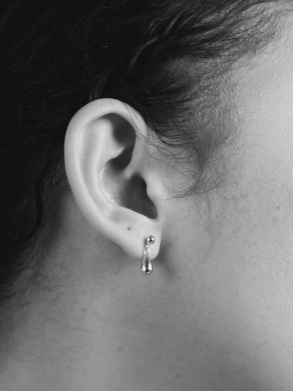 Dylan droplet charm shown mid-movement to demonstrate subtle sway
