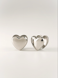 close up puffed heart earrings polished surface