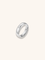 Rae Eternal Diamond Ring silver tone stainless steel, polished dome band with bezel-set CZ stone, product flatlay