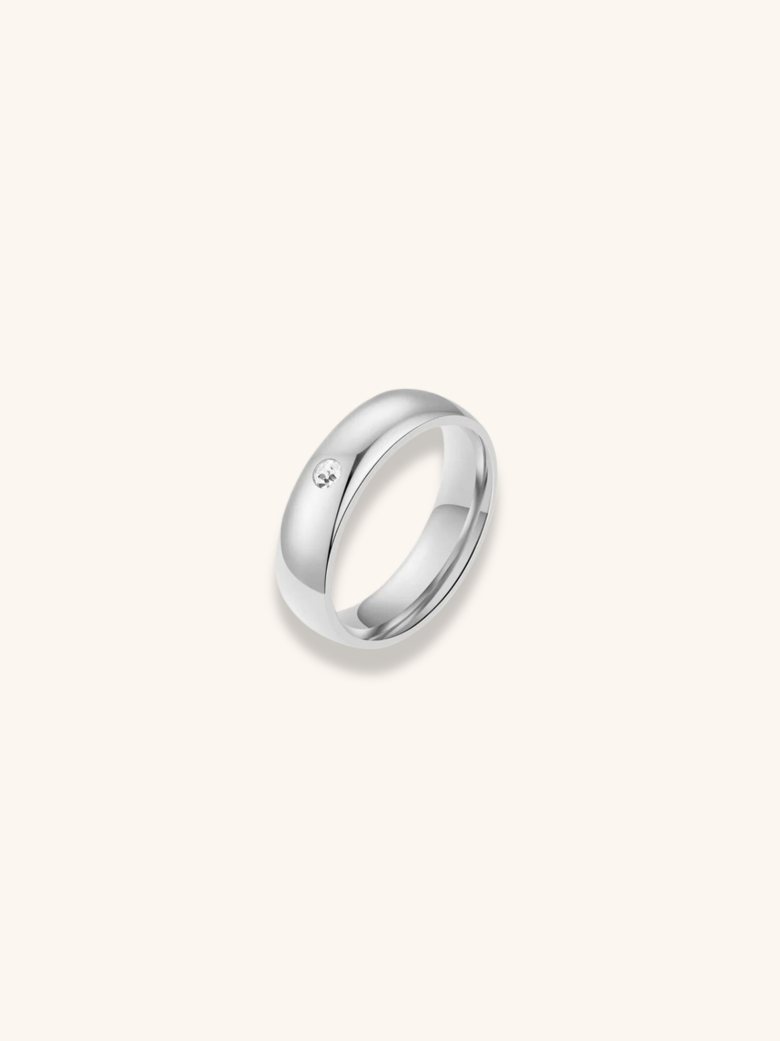 Rae Eternal Diamond Ring silver tone stainless steel, polished dome band with bezel-set CZ stone, product flatlay