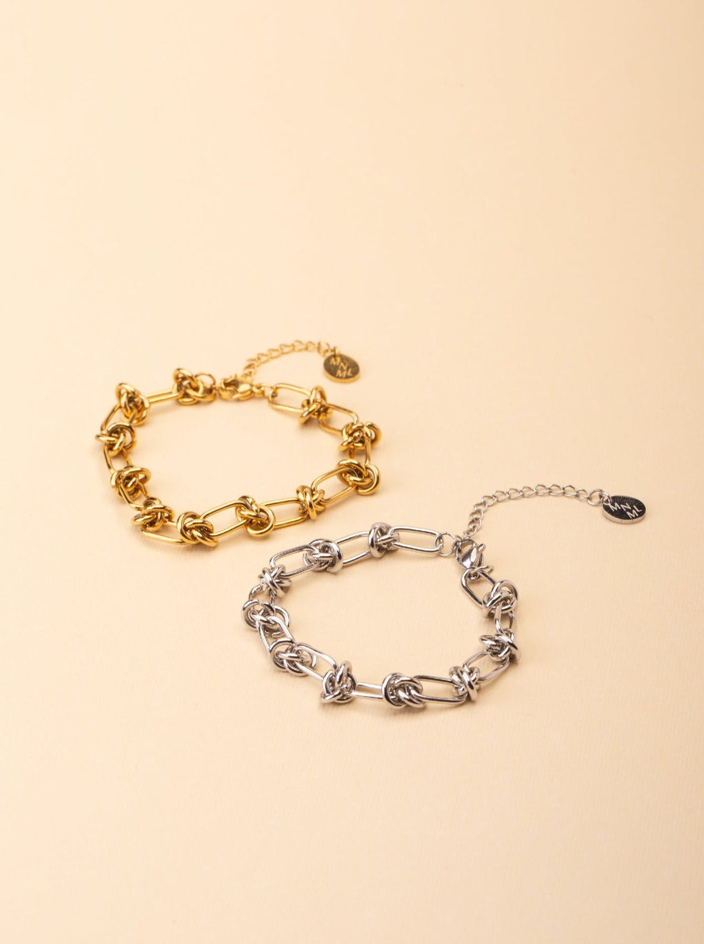Rebel Knotted Chain Bracelet gold and silver tone stainless steel, bold knotted paperclip chain, product flatlay