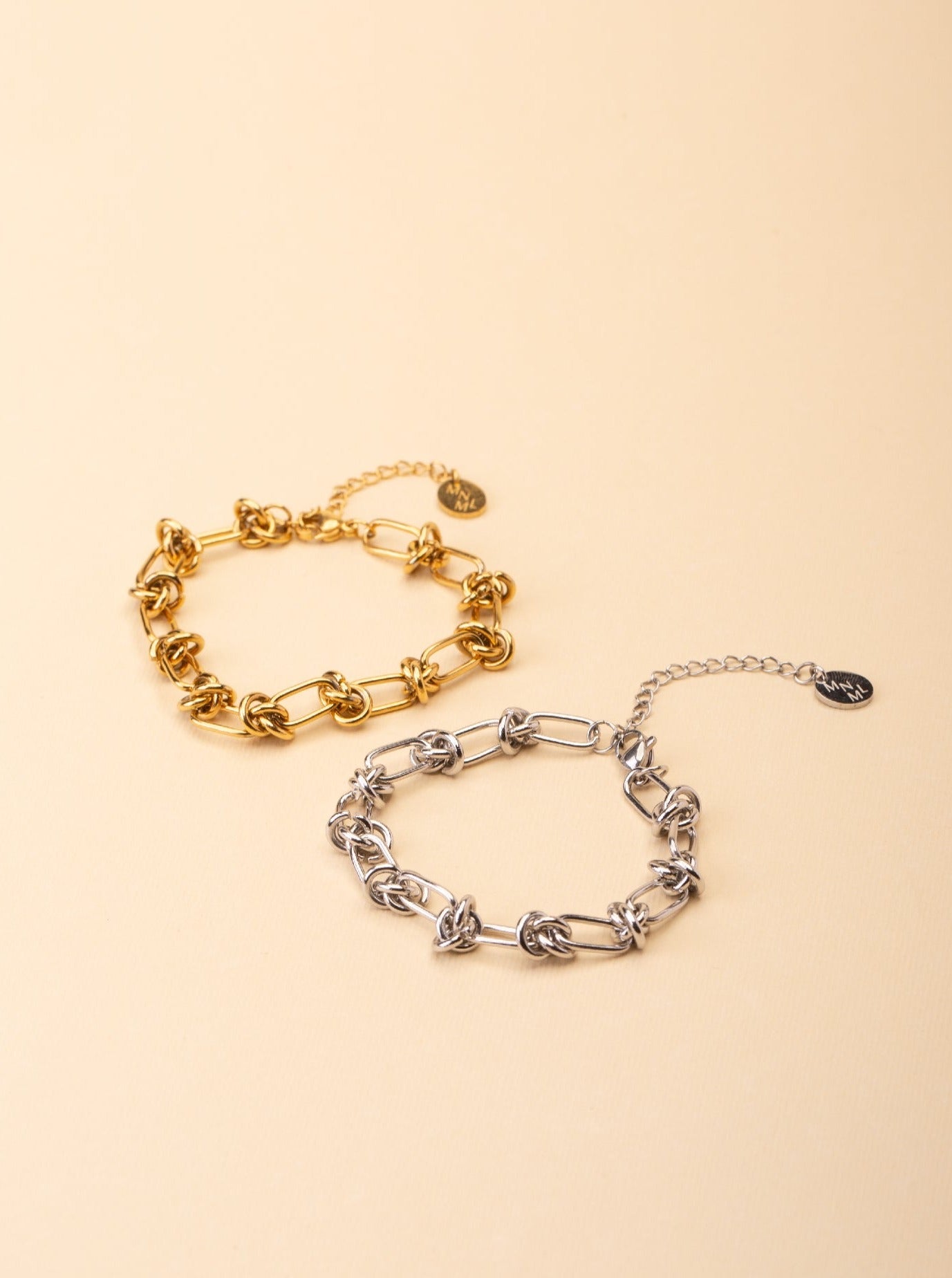 Rebel Knotted Chain Bracelet gold and silver tone stainless steel, bold knotted paperclip chain, product flatlay