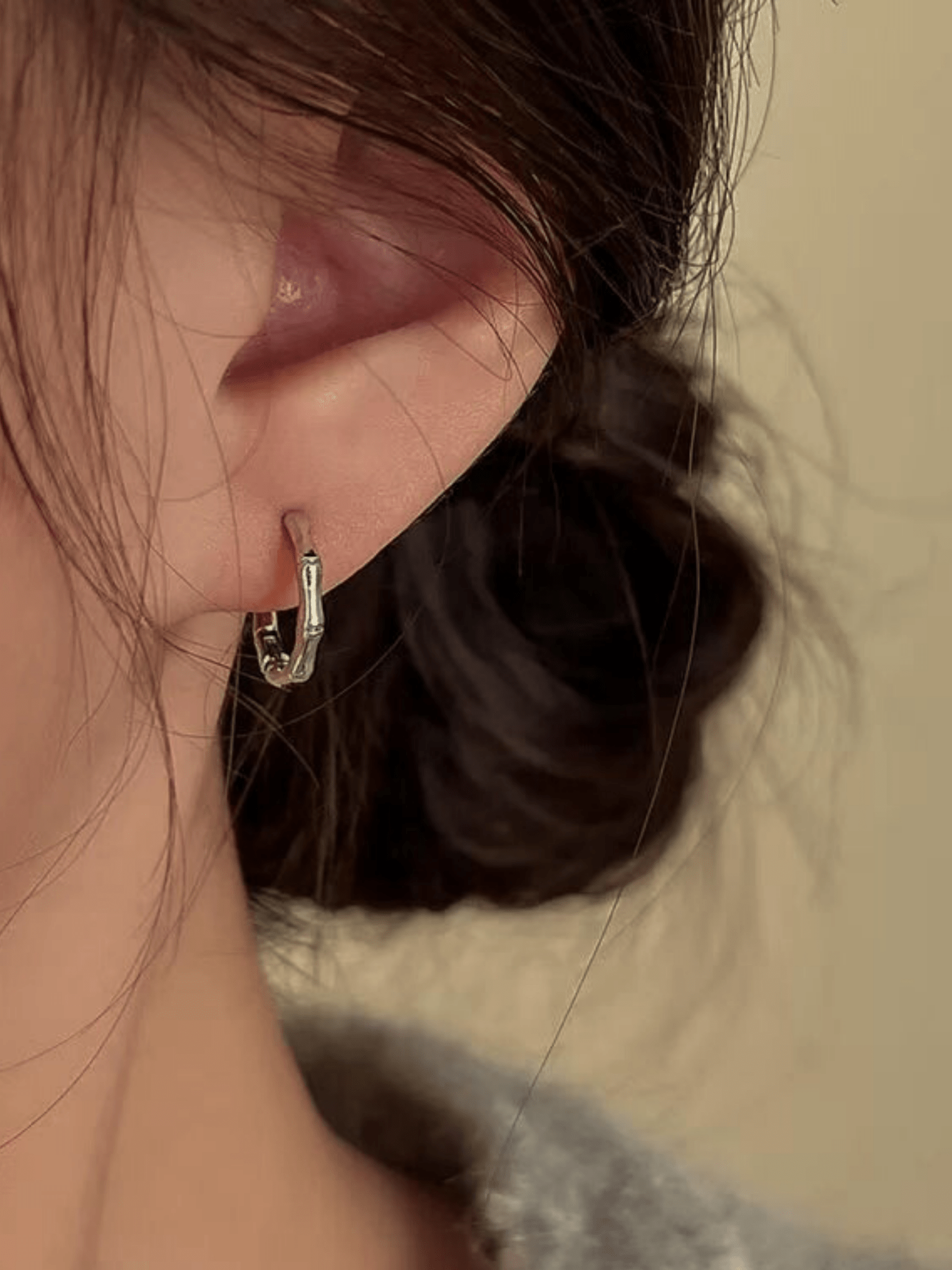 Reiko Bamboo Hoop Earrings worn on ear