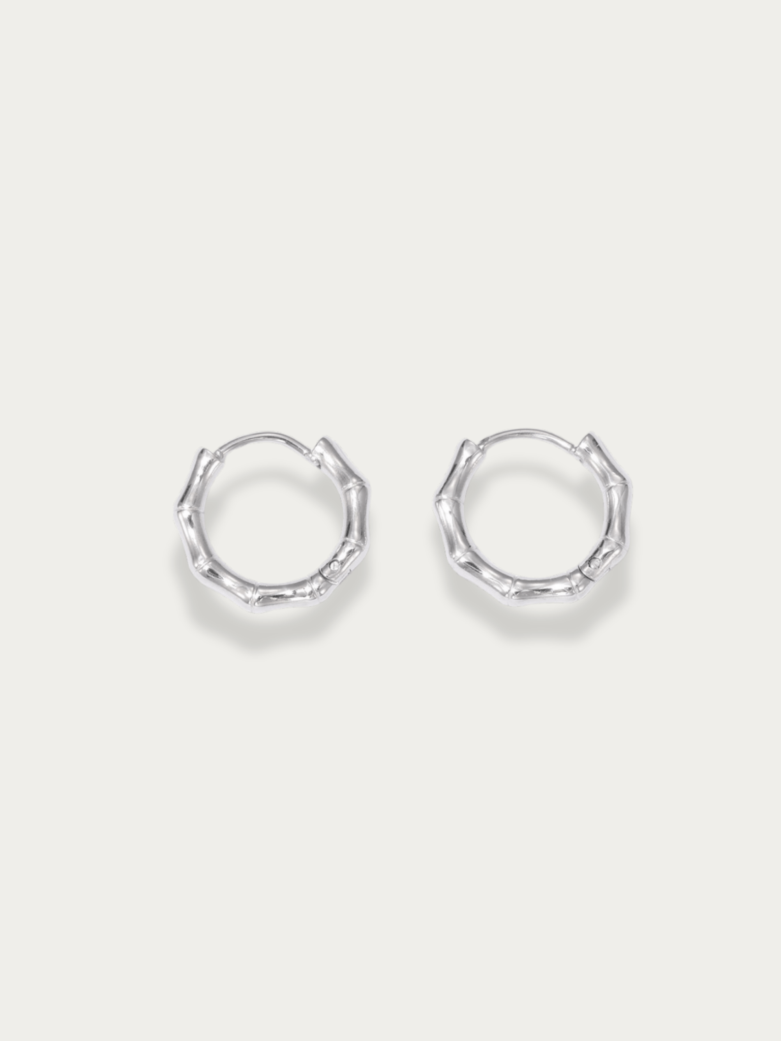 Reiko Bamboo Hoop Earrings pair in gold-toned stainless steel with bamboo texture, studio hero shot in silver colour