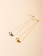 Resilience Droplet Necklace gold and silver tone side by side comparison flatlay, MNML Malaysia