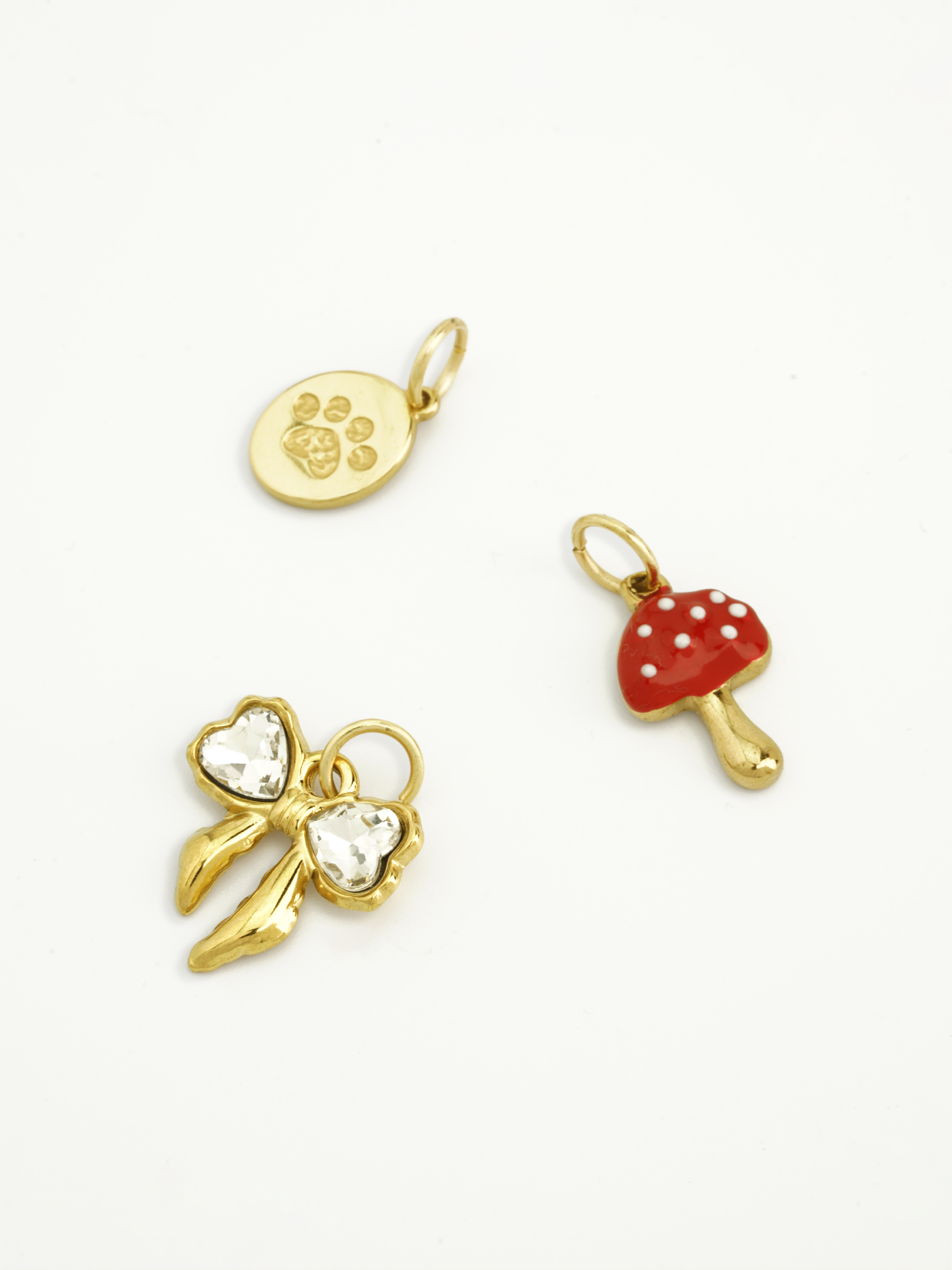Ribbon knot charm gold plated with sparkling stone detail