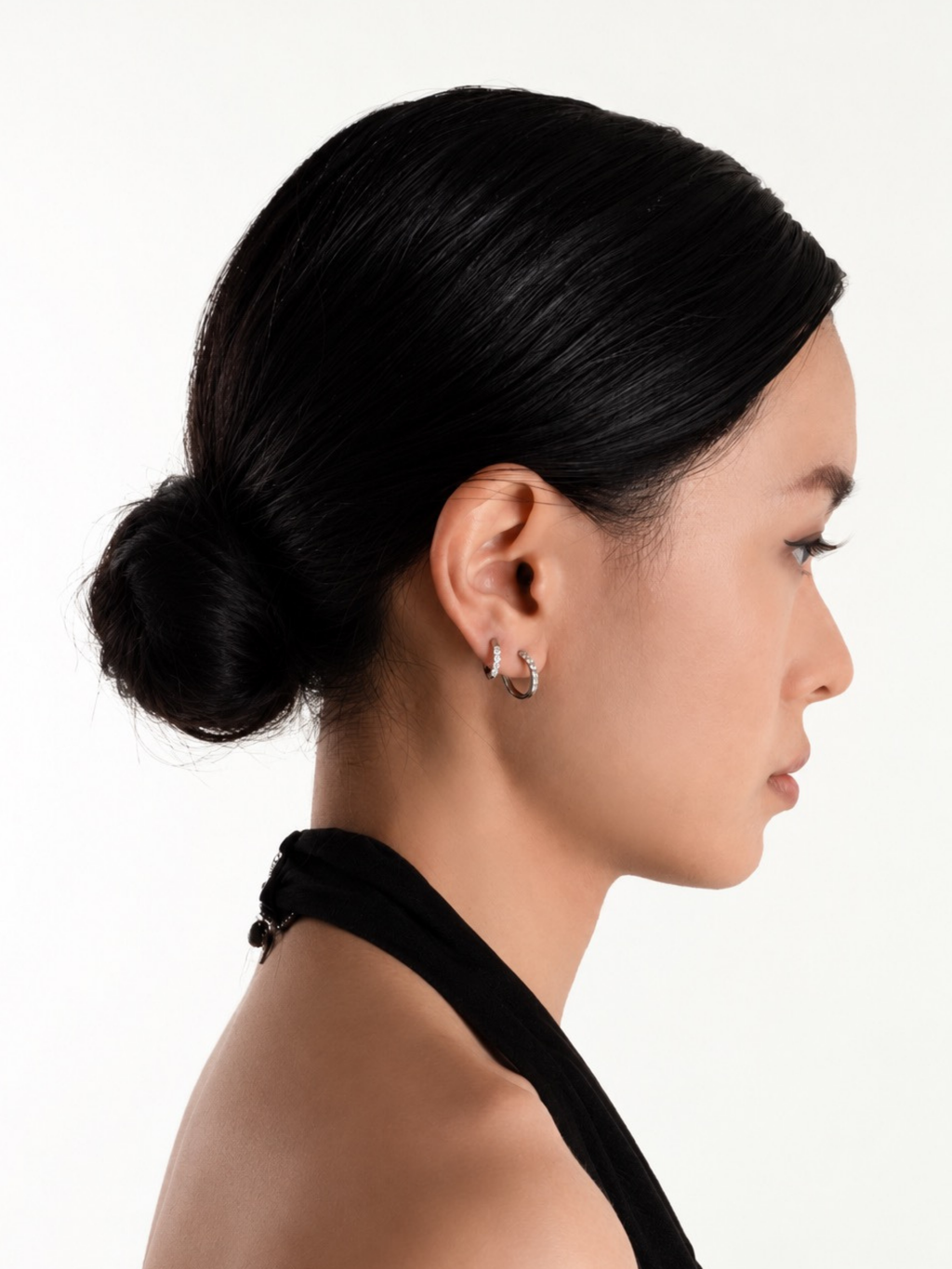 Ritual Pavé Huggie Earrings worn on model's ear