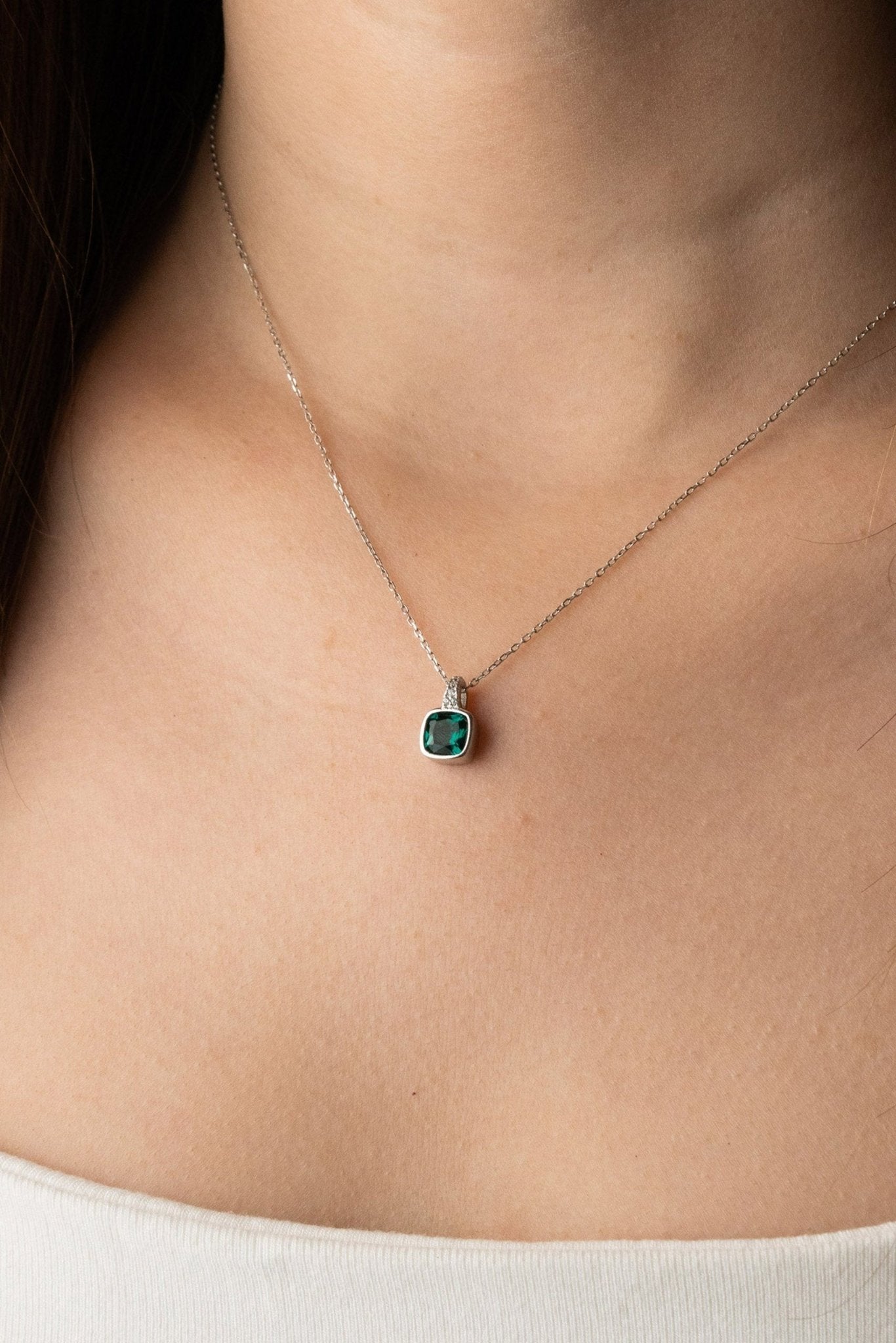 Model wearing ROBBIE Emerald Diamond Necklace at the collarbone